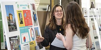 student presenting poster during Sustainability Awards Student Showcase